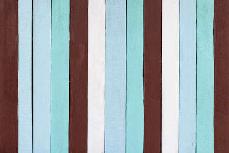 Old wooden house wall with many colors in vintage style texture and background seamlessの写真素材