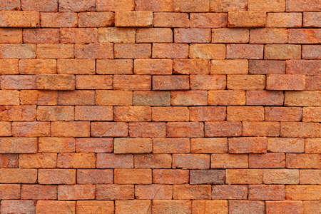 Wall brown brick wall texture background. Brickwork or stonework flooring interior rock old pattern clean concrete grid uneven bricks design stack wallsの写真素材