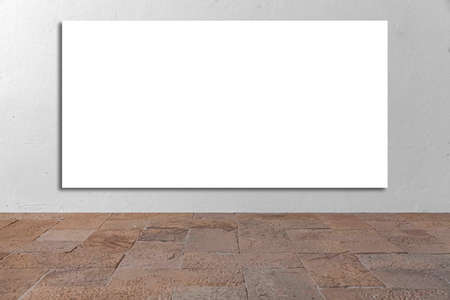 A large blank billboard on the white cement wall outside the buildingの写真素材