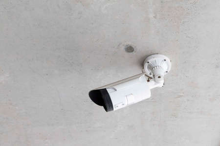 Small CCTV camera for security installed at the buildingの写真素材