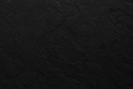 Dark grey black slate background or texture. Black granite slabs backgroundの写真素材