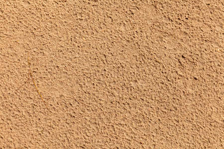 Sand texture. Sandy beach for background. Top view. Natural sand stone texture background. sand on the beach as background. Wavy sand background for summer designsの写真素材