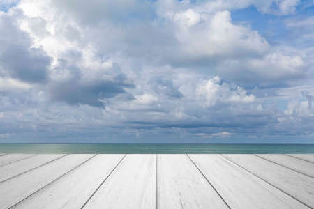 Wood perspective on sea image background. Empty top of wooden table. wood table top on blurred blue seaの写真素材