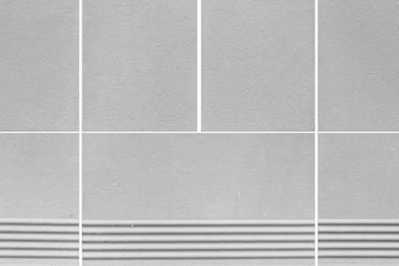 White granite tiled wall with vintage pattern texture and background seamlessの写真素材