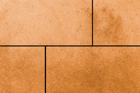 Brown granite tiled wall with vintage pattern texture and background seamlessの写真素材