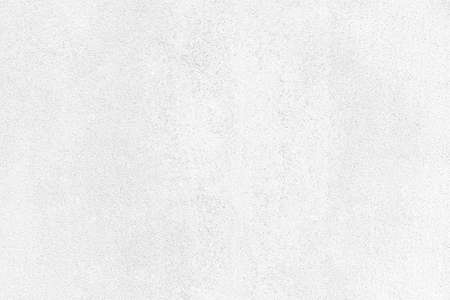 Old cement wall outside the building, painted white, smooth surface texture and background seamlessの写真素材