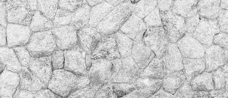 Panorama of white natural stone wall pattern and background textureの写真素材