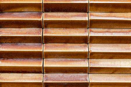 light brown glazed tiled wall pattern ans background seamlessの写真素材