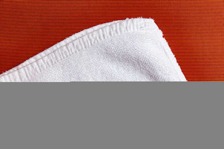 Clean white towels folded on brown wood tableの写真素材