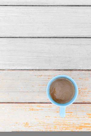 The coffee mug placed on the wood table topの写真素材