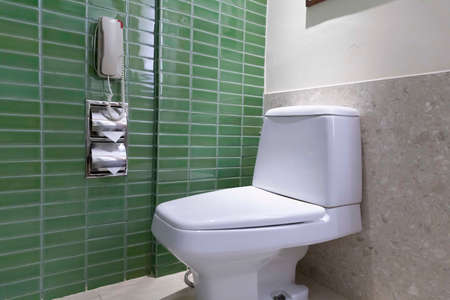 White ceramic toilet in a classic toiletの写真素材