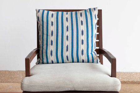 Brown wooden chairs and blue cushions on the balconyの写真素材