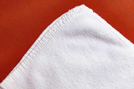 Clean white towels folded on brown wood tableの写真素材