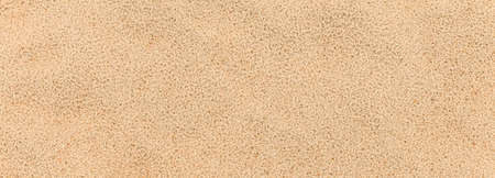 Panorama of Sand texture. Sandy beach for background. Top view. Natural sand stone texture background. sand on the beach as background. Wavy sand background for summer designsの写真素材
