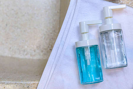 Clear plastic bottles for shampoo and body wash in the showerの写真素材