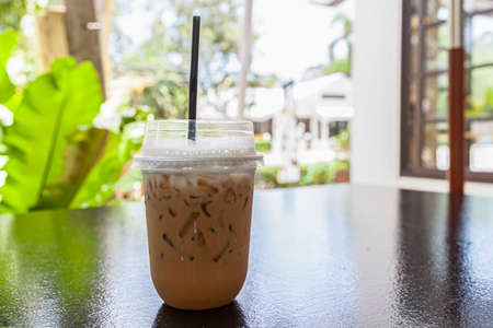 Iced cappuccino in a plastic take-out cupの写真素材