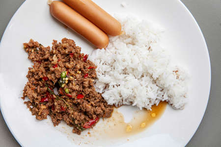 Famous Thai food , Fried stir basil with minced pork and Sausage and Steamed Riceの写真素材