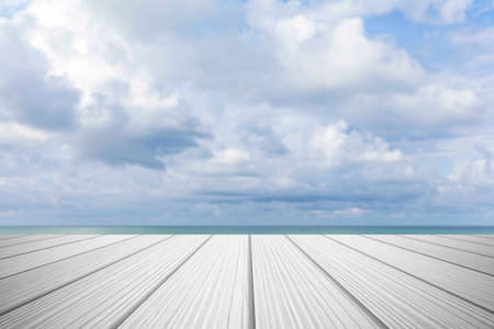 Wood perspective on sea image background. Empty top of wooden table. wood table top on blurred blue seaの写真素材