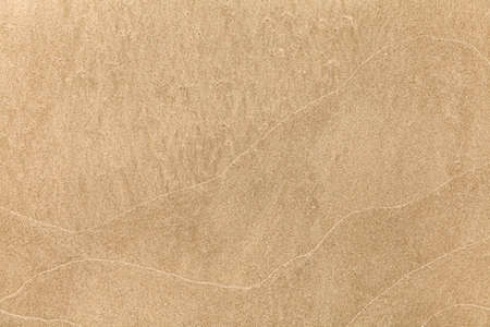 Sand texture. Sandy beach for background. Top view. Natural sand stone texture background. sand on the beach as background. Wavy sand background for summer designsの写真素材