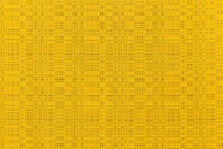 Yellow canvas texture background of cotton burlap natural fabric cloth for wall paper and painting design backdropの写真素材