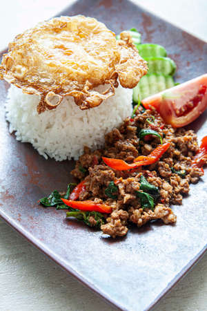 Famous Thai food Holy Basil with Minced Pork and Fried Eggの写真素材