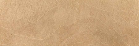 Panorama of Sand texture. Sandy beach for background. Top view. Natural sand stone texture background. sand on the beach as background. Wavy sand background for summer designsの写真素材