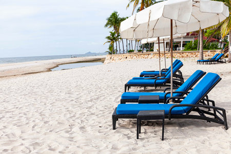 Empty sun beds at the beach of the hotel in relief of the epidemicの写真素材