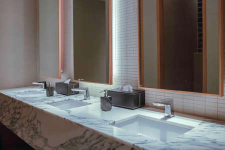 Modern white marble sink in a luxurious bathroomの写真素材