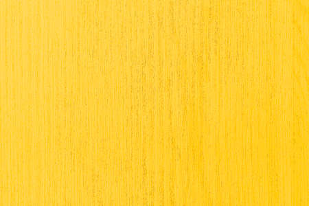 Yellow vintage wooden table top pattern texture and seamless backgroundの写真素材