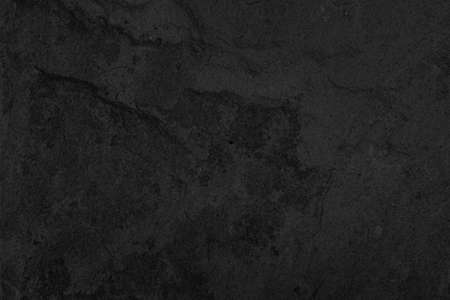 Dark grey black slate background or texture. Black granite slabs backgroundの写真素材
