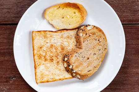 Breakfast plate, toast and jam with butterの写真素材