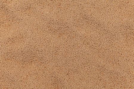 Sand texture. Sandy beach for background. Top view. Natural sand stone texture background. sand on the beach as background. Wavy sand background for summer designsの写真素材