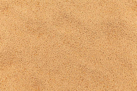 Sand texture. Sandy beach for background. Top view. Natural sand stone texture background. sand on the beach as background. Wavy sand background for summer designsの写真素材