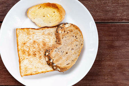 Breakfast plate, toast and jam with butterの写真素材
