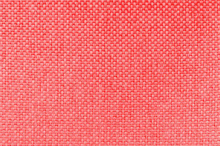 Red canvas texture background of cotton burlap natural fabric cloth for wallpaper and painting design backdropの写真素材