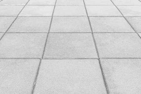 Perspective View Monotone white Brick Stone Pavement on The Ground for Street Roadの写真素材