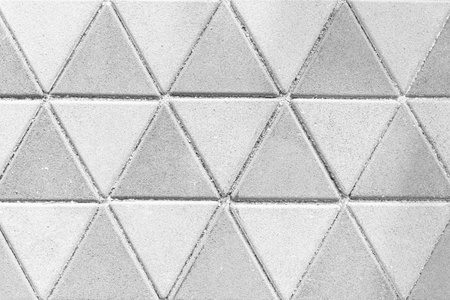 White cement block floor tile with triangular pattern and background seamlessの写真素材