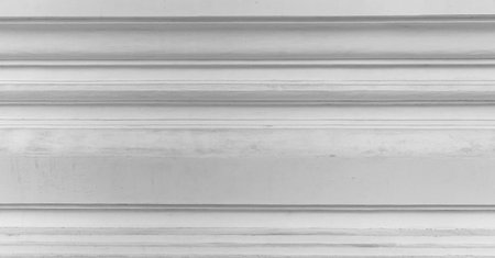 Panorama of Vintage white painted cement wall with rough surface texture and background seamlessの写真素材