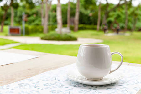 The coffee mug placed on brown wood tableの写真素材