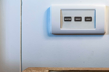 Electrical control switch panel at the head of the bed in the bedroomの写真素材