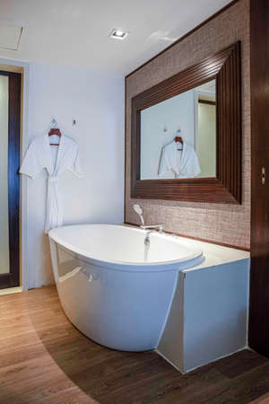 White ceramic Bath tub in modern shower roomの写真素材