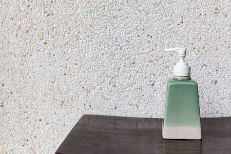 White ceramic body lotion bottle placed at the shower roomの写真素材