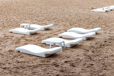 Empty sun beds at the beach of the hotel in relief of the epidemicの写真素材