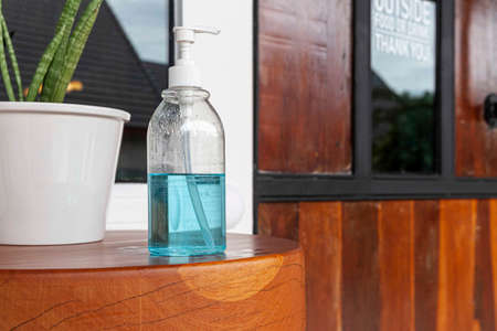 Alcohol bottles are prepared for customers at restaurant entranceの写真素材