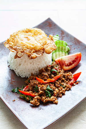Famous Thai food Holy Basil with Minced Pork and Fried Eggの写真素材