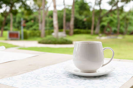 The coffee mug placed on brown wood tableの写真素材