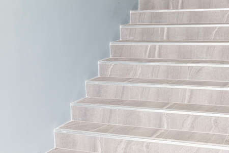 Building exterior stairs with antique white brown granite tilesの写真素材