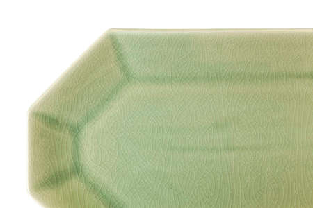 Light green celadon porcelain plate isolated on a white backgroundの写真素材