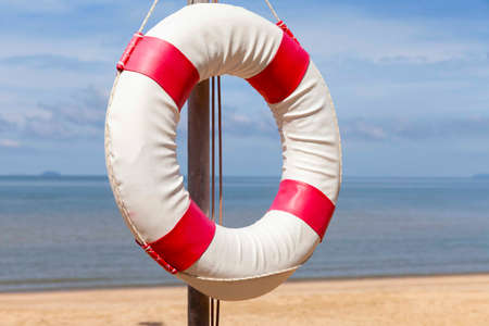 Lifebuoys for tourists are prepared in front of the resort hotelの写真素材