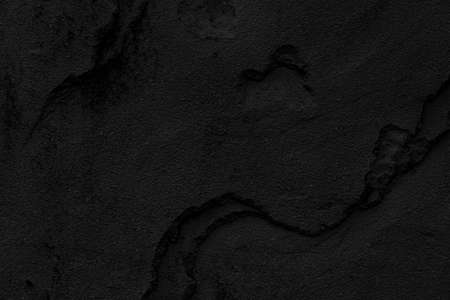 Dark grey black slate background or texture. Black granite slabs backgroundの写真素材